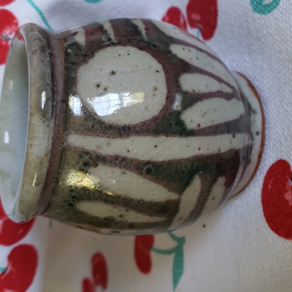 Glazed small pottery vase signed Velda. Brown, beige, black
